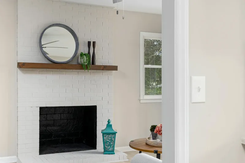 White brick fireplace converted from wood to gas