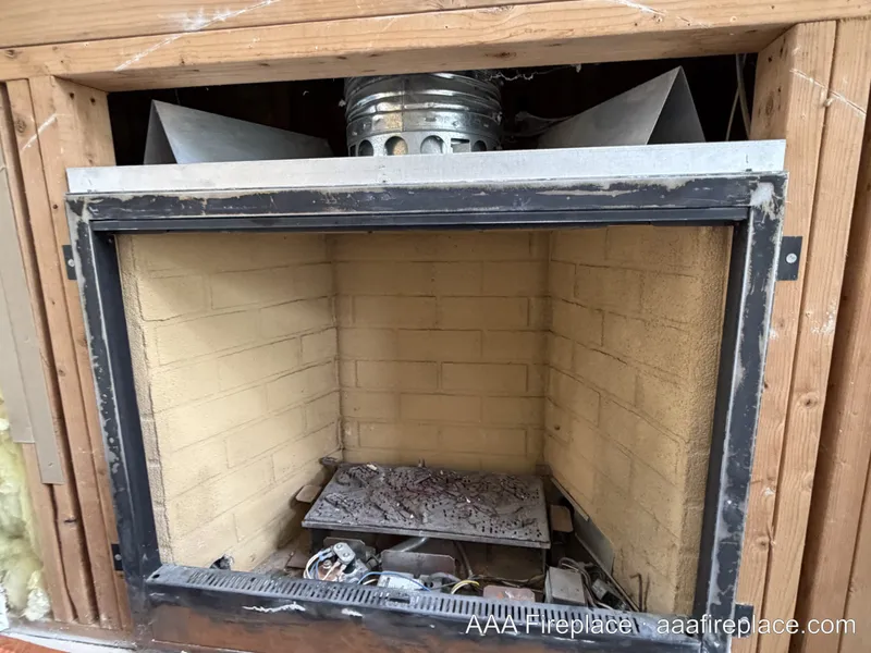 Aging gas burner components inside a firebox before replacement